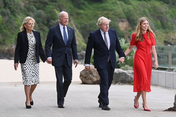 G7 Bidens and Johnsons walk hand-in-hand - enlarge